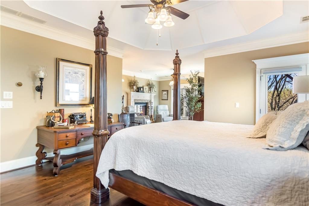 181 Valley View Vista Jasper, GA 30143 - Photo 27 of 98 a bedroom with a bed and a chandelier