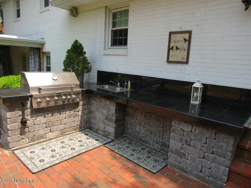3302 Robin Road Louisville, KY 40213 - Photo 23 of 25 Outdoor kitchen with a built-in stainless steel grill, prep space, and sink