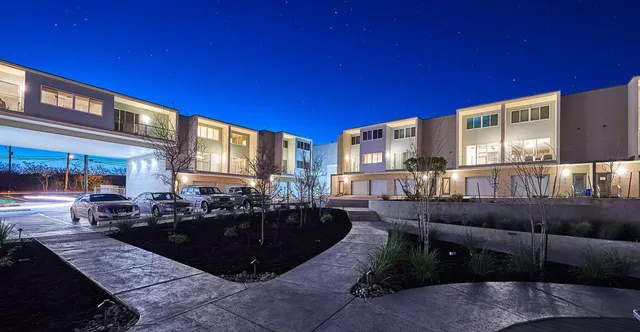 a view of a living room and kitchen