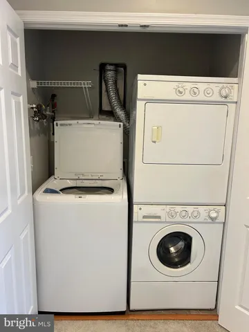 a bathroom with a double vanity sink mirror and tub