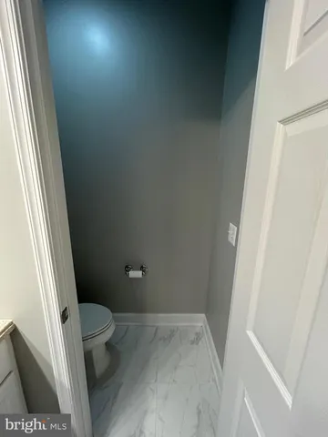 a bathroom with a tub a sink and a shower