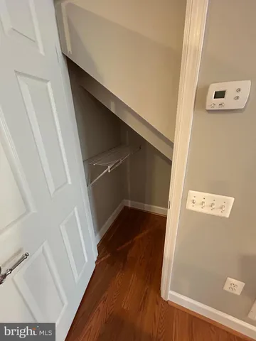 view of a closet with wooden floor