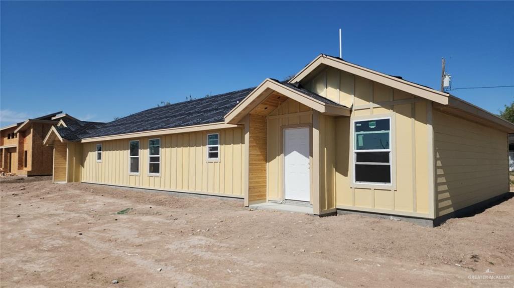 909 Skyview Street Weslaco, TX 78596 - Photo 1 of 1 a front view of a house with a garage