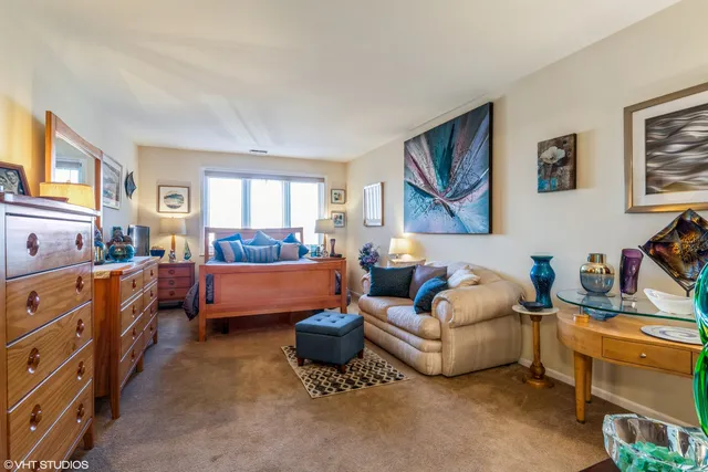 a bedroom with furniture and a window