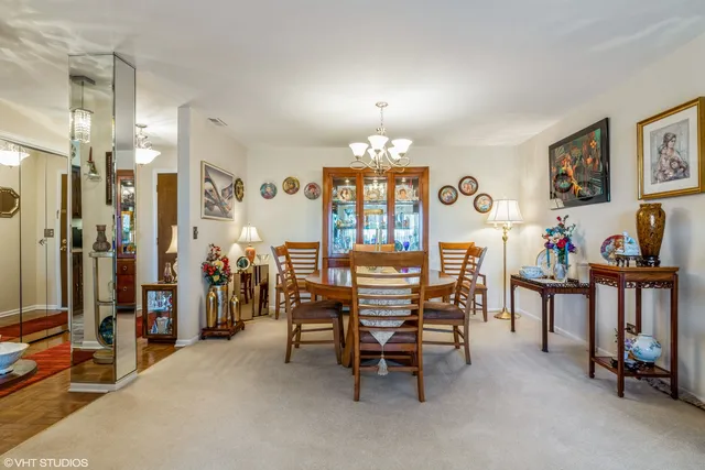 a view of a livingroom with furniture and a dining table