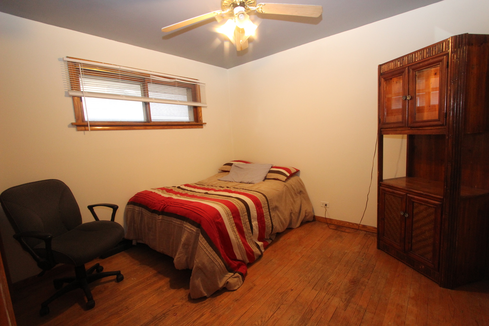 1464 Ridge Road Homewood, IL 60430 - Photo 8 of 16 a bedroom with a bed chair and a window