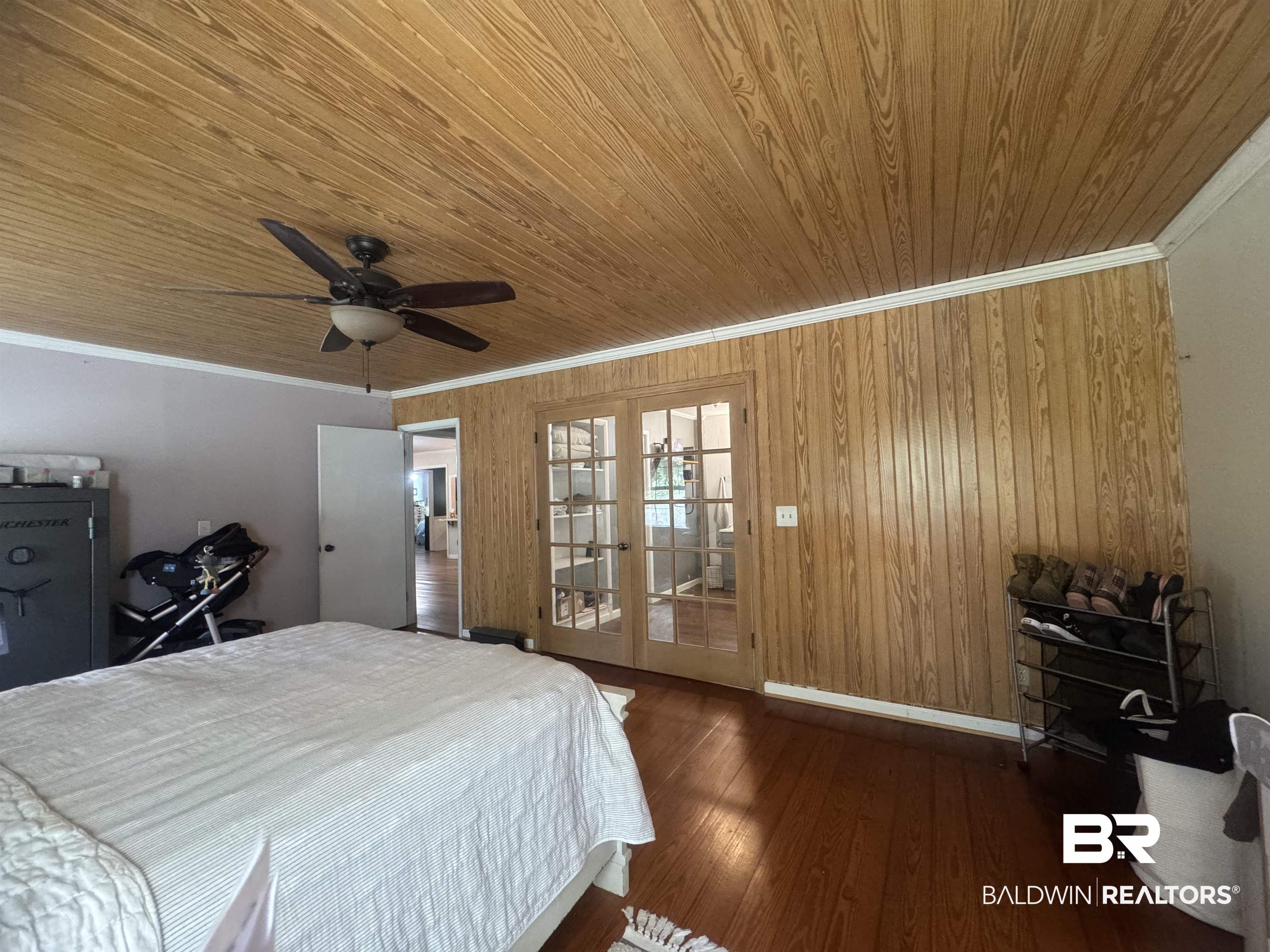3097 Old Castleberry Road Brewton, AL 36426 - Photo 21 of 49 Bedroom featuring dark wood-type flooring, ceiling fan, crown molding, and wooden ceiling