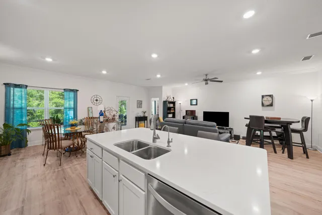 a view of kitchen with sink and living room