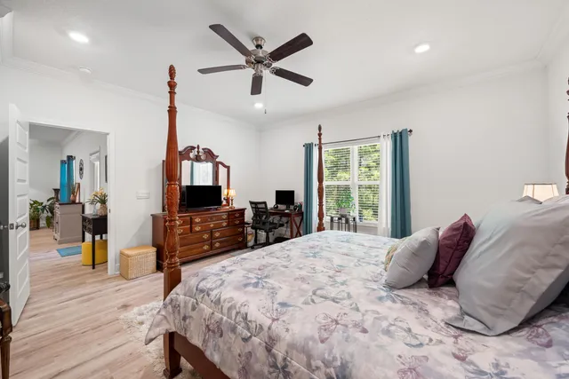 a bed room with a bed and a television