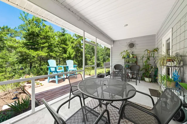 a dining room with furniture and a garden
