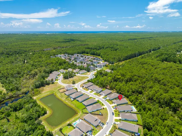 an aerial view of residential houses with outdoor space