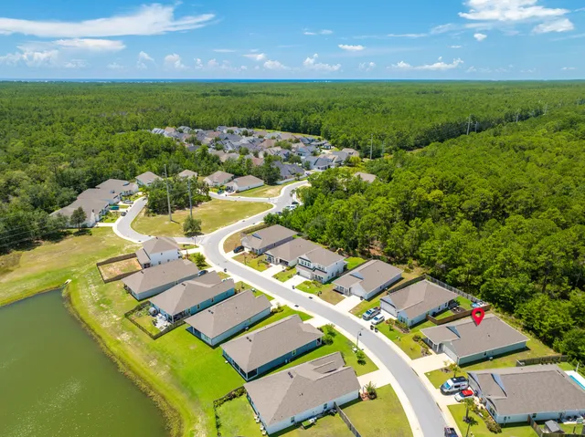 an aerial view of a house with a garden