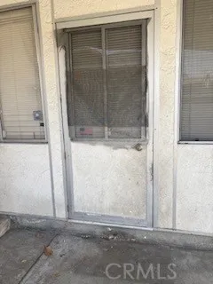 a living room with furniture and curtain