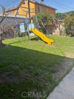a view of a backyard with swimming pool
