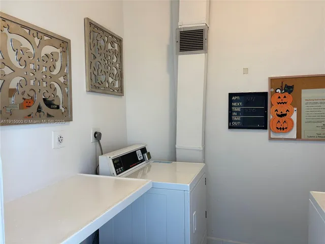 a view of a room with furniture and wooden floor