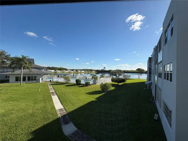 a view of a house with a big yard
