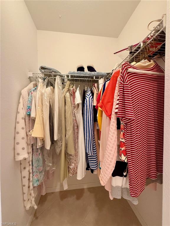 8450 Kingbird Loop, Unit 431 Estero, FL 33967 - Photo 20 of 47 Walk in closet with tile patterned floors