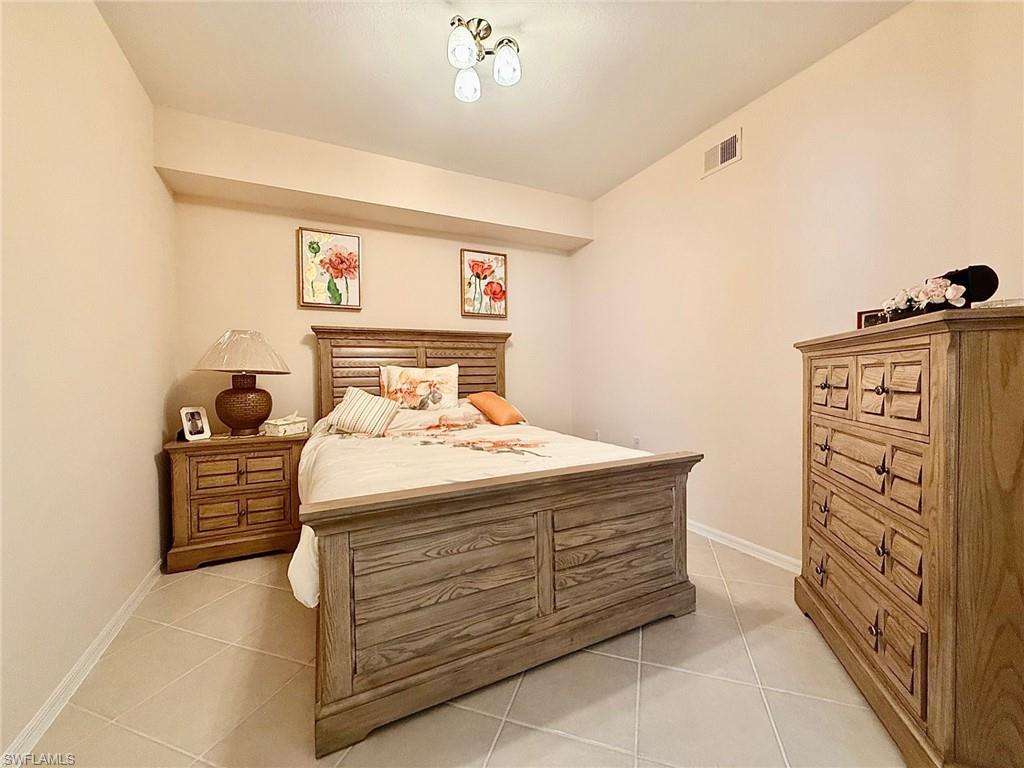 8450 Kingbird Loop, Unit 431 Estero, FL 33967 - Photo 27 of 47 Bedroom with light tile patterned floors
