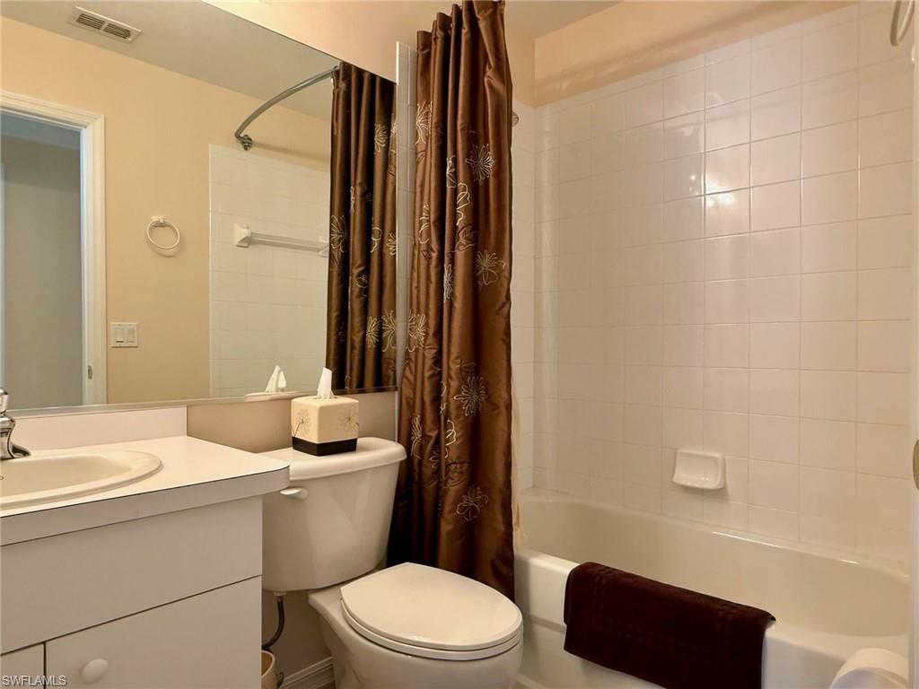 8450 Kingbird Loop, Unit 431 Estero, FL 33967 - Photo 29 of 47 Bathroom with shower / tub combo and vanity