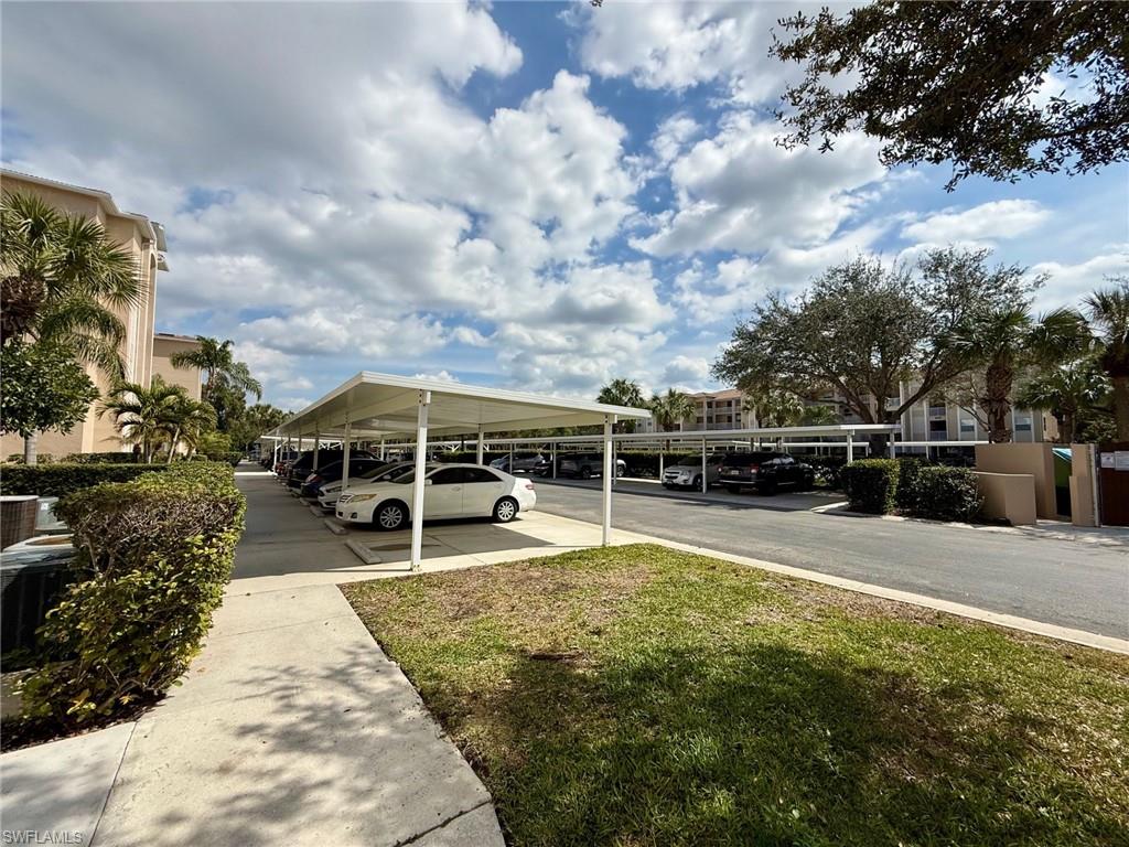 8450 Kingbird Loop, Unit 431 Estero, FL 33967 - Photo 3 of 47 View of partially covered parking lot