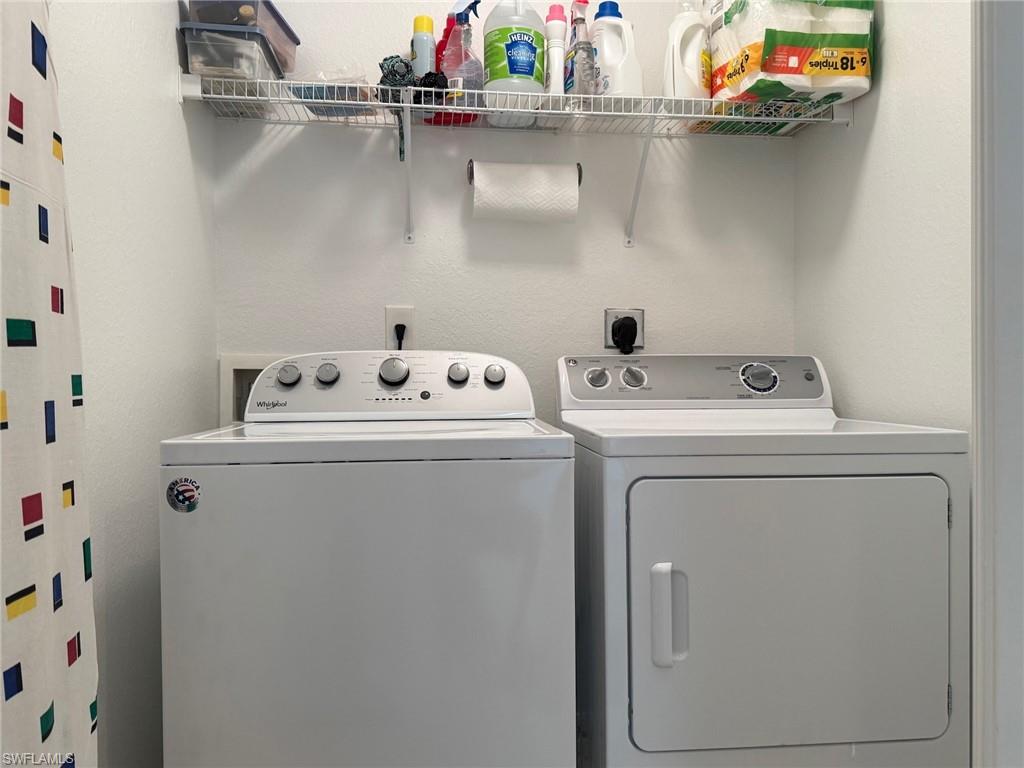8450 Kingbird Loop, Unit 431 Estero, FL 33967 - Photo 34 of 47 Laundry area featuring washer and clothes dryer