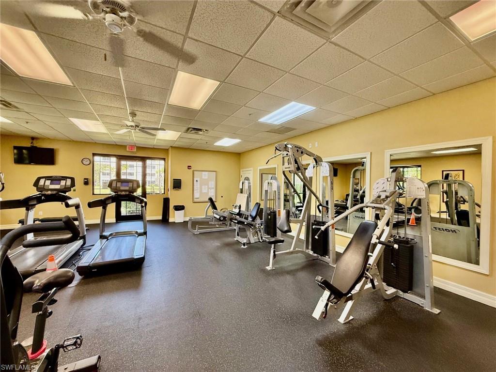 8450 Kingbird Loop, Unit 431 Estero, FL 33967 - Photo 44 of 47 Workout area with a paneled ceiling and ceiling fan