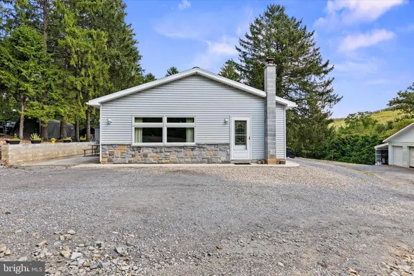 a house with trees in the background
