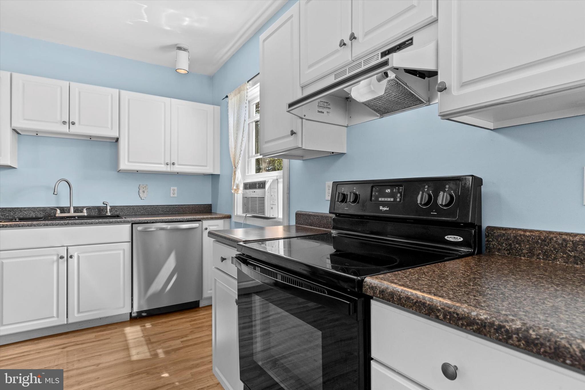 239 Hill Street Lykens, PA 17048 - Photo 11 of 43 a kitchen with granite countertop a stove and a sink