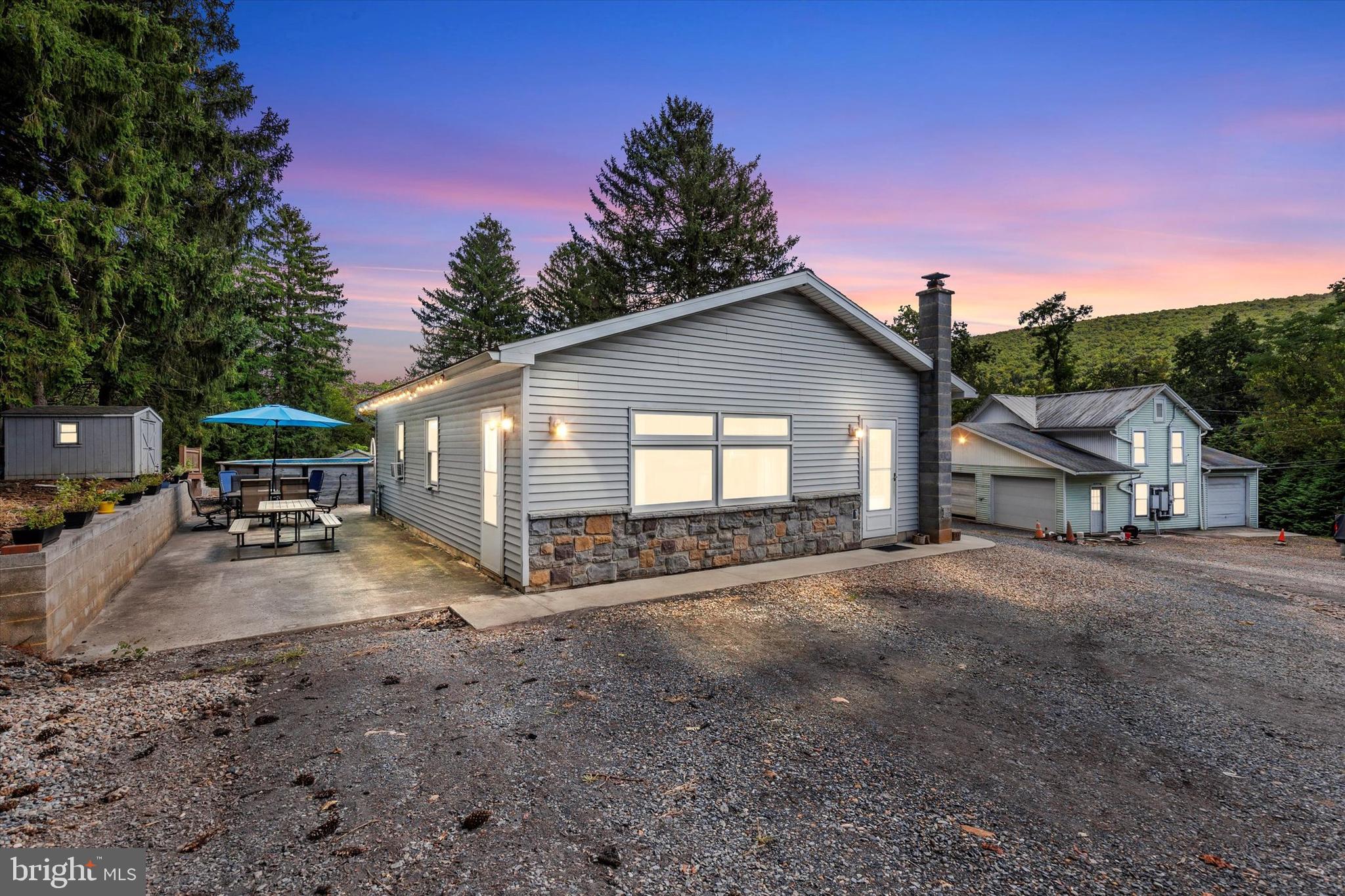 239 Hill Street Lykens, PA 17048 - Photo 2 of 43 a view of a house with backyard space and a car parked in it