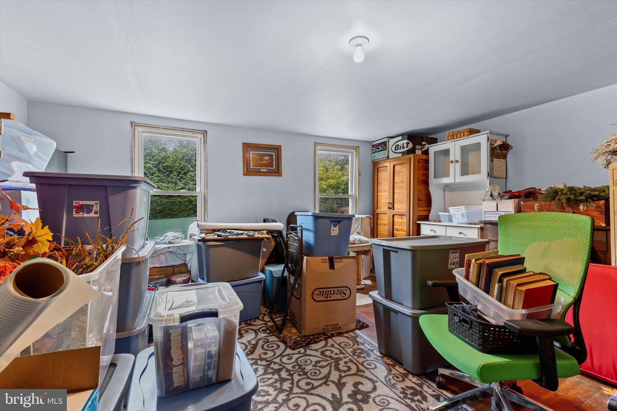 239 Hill Street Lykens, PA 17048 - Photo 28 of 43 a room with furniture a rug workspace and windows