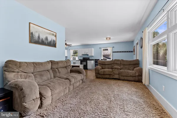 a living room with furniture and a window