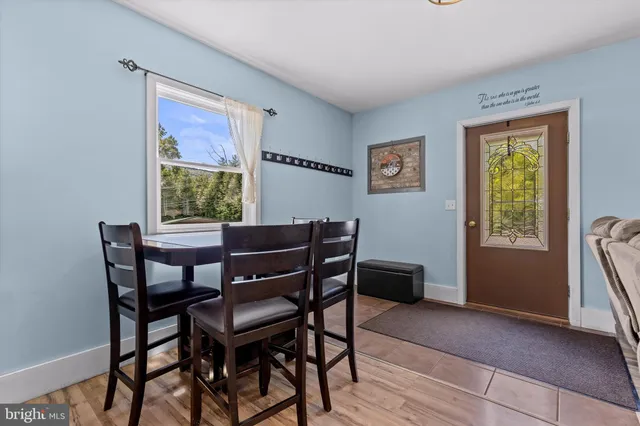 a dining room with furniture and window