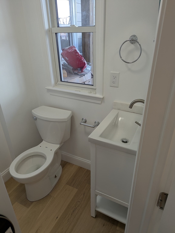 296 Fulton Street, Unit 1 Medford, MA 02155 - Photo 18 of 19 a bathroom with a toilet and a sink