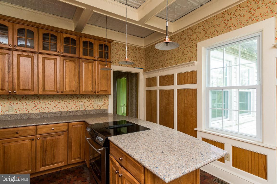 5760 Middleburg Road Keymar, MD 21757 - Photo 14 of 25 a kitchen that has a cabinets window and wooden floor