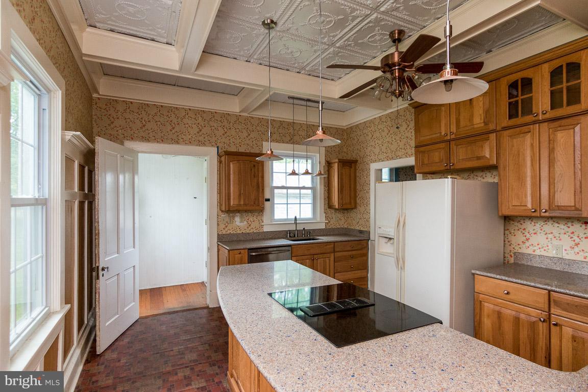 5760 Middleburg Road Keymar, MD 21757 - Photo 15 of 25 a kitchen with stainless steel appliances granite countertop a refrigerator and a stove top oven