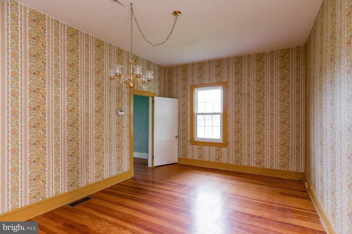 5760 Middleburg Road Keymar, MD 21757 - Photo 17 of 25 a view of a room with wooden floor and windows