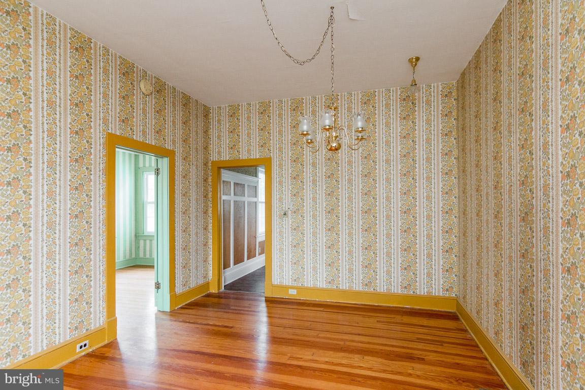 5760 Middleburg Road Keymar, MD 21757 - Photo 18 of 25 a view of a hallway with wooden floor and a window