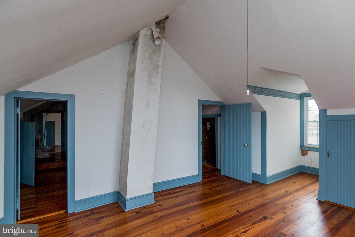 5760 Middleburg Road Keymar, MD 21757 - Photo 22 of 25 a view of an empty room with wooden floor and closet