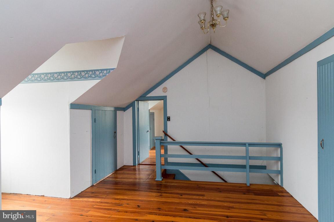 5760 Middleburg Road Keymar, MD 21757 - Photo 23 of 25 a view of entryway and hall with wooden floor