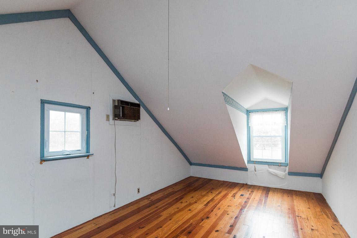 5760 Middleburg Road Keymar, MD 21757 - Photo 24 of 25 a view of empty room with wooden floor and fan