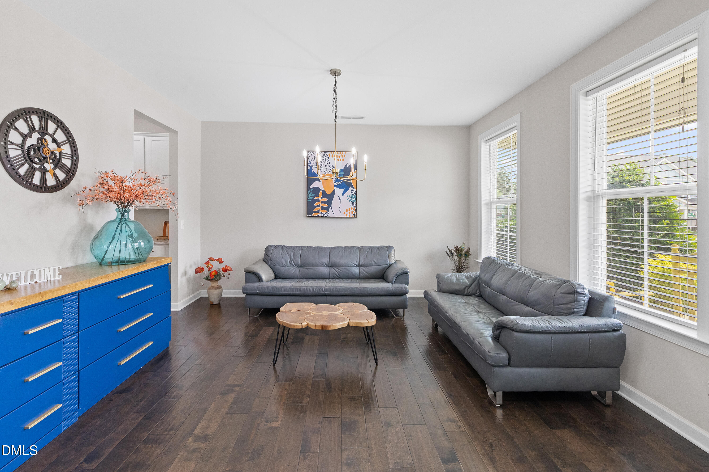 8059 Gilano Drive Raleigh, NC 27603 - Photo 12 of 43 a living room with furniture and a wooden floor