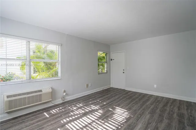 a view of an empty room and window