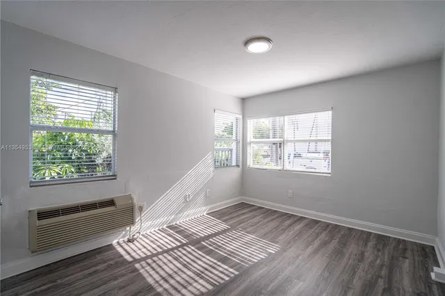 a view of an empty room with a window