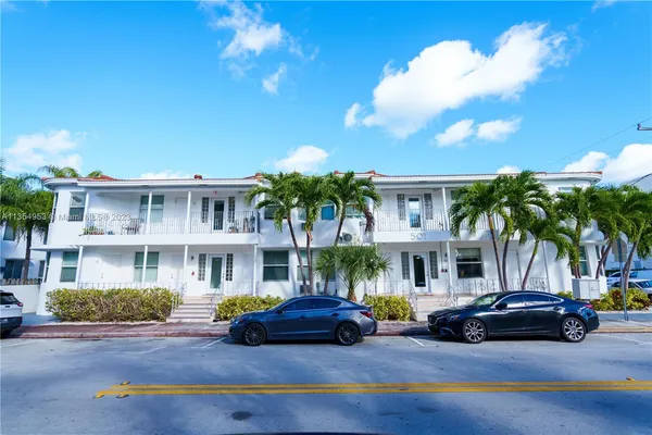 a view of street with parked cars