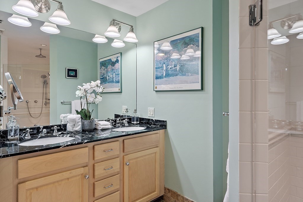 95 Conant Street, Unit 304 Concord, MA 01742 - Photo 13 of 23 a bathroom with a double vanity sink mirror and double