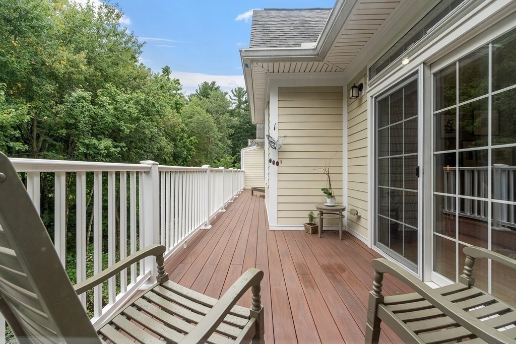 95 Conant Street, Unit 304 Concord, MA 01742 - Photo 18 of 23 a view of balcony with wooden floor and fence