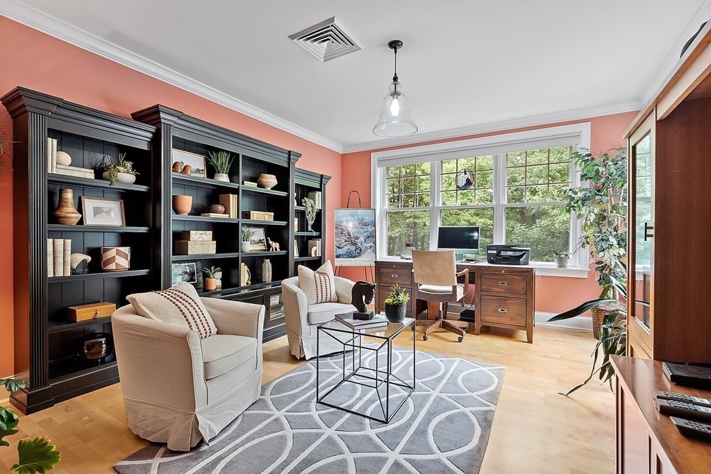 95 Conant Street, Unit 304 Concord, MA 01742 - Photo 2 of 23 a living room with fireplace furniture and a large window