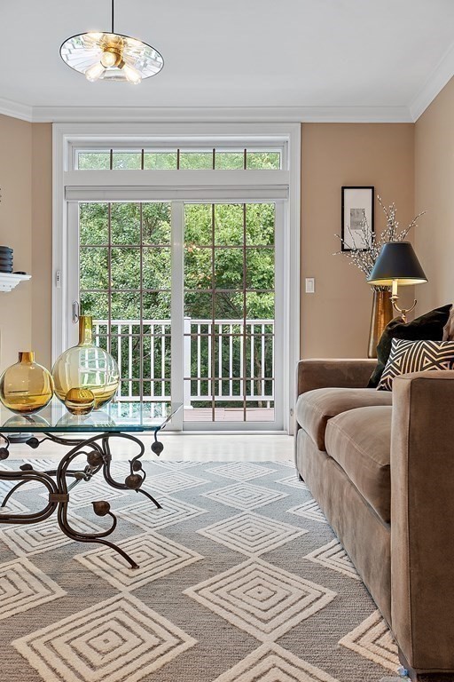 95 Conant Street, Unit 304 Concord, MA 01742 - Photo 7 of 23 a bedroom with furniture and a large window