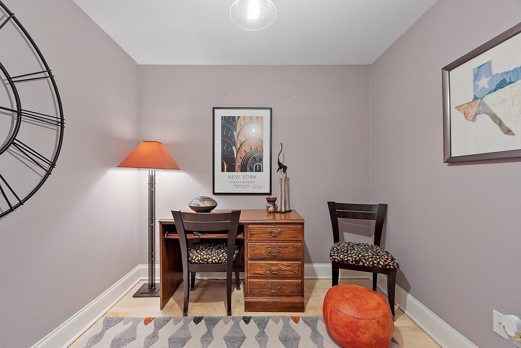 95 Conant Street, Unit 304 Concord, MA 01742 - Photo 9 of 23 a workspace with furniture and lamp