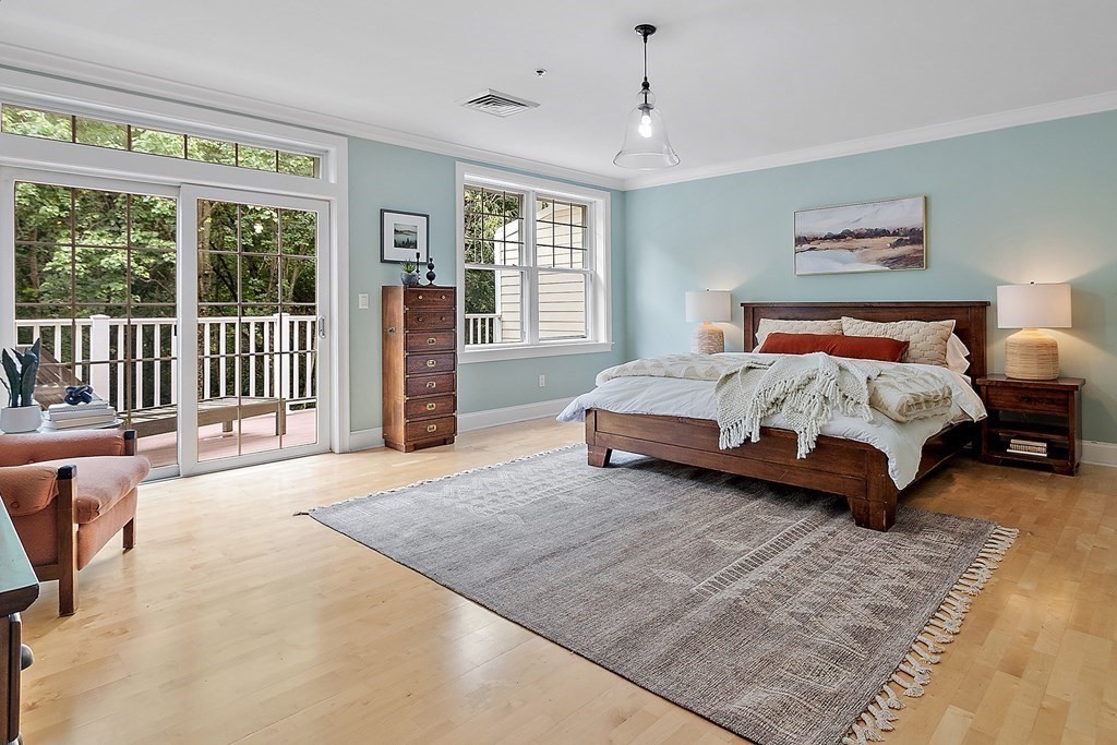95 Conant Street, Unit 304 Concord, MA 01742 - Photo 10 of 23 a spacious bedroom with a bed and glass door
